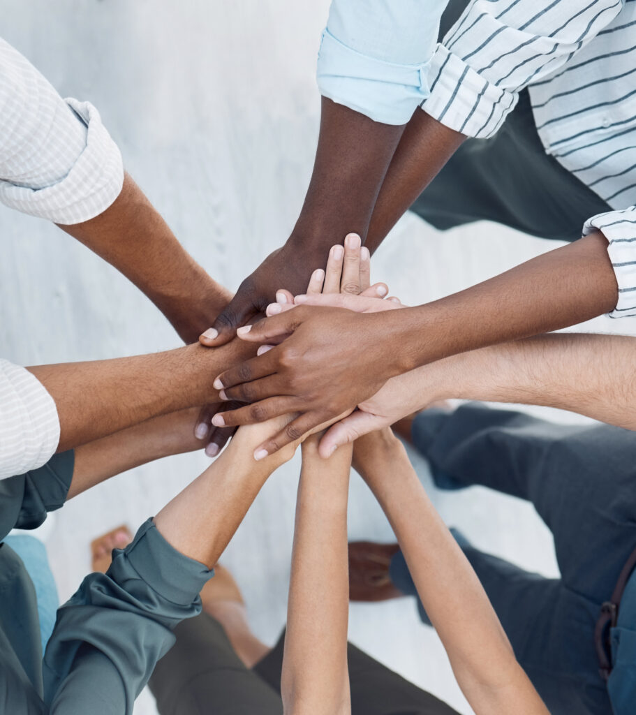 Group hand of diverse people in teamwork, cooperation and solidarity for community